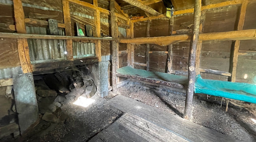 Dirt floor. Canvas or hessian bunks. Huge open fire. | Old Basins Hut, Craigieburn Forest Park