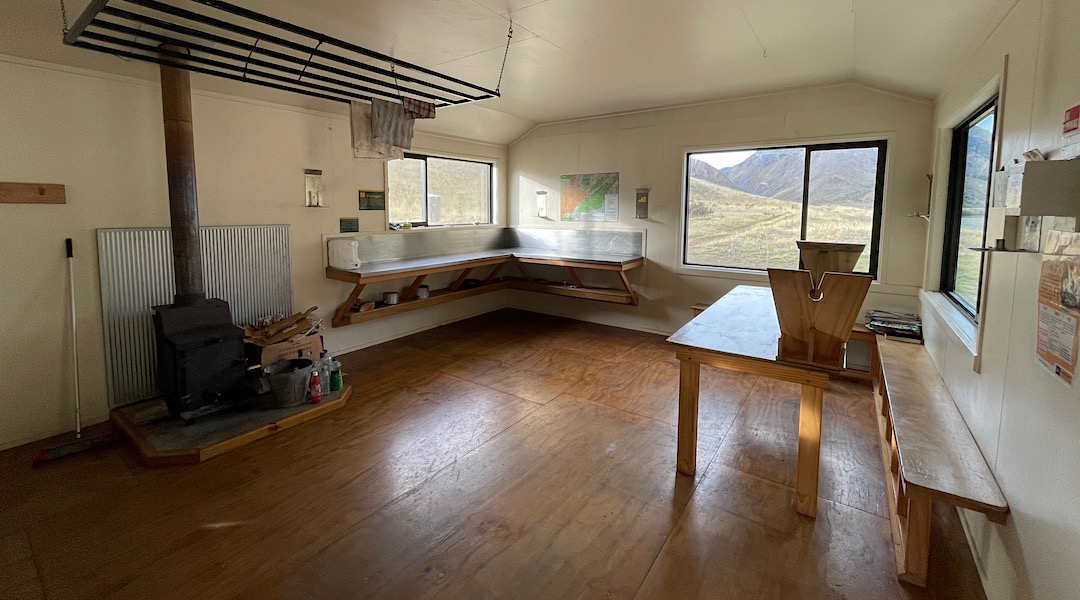 Decent bench space for usual number of occupants. | Palmer Hut, Ka Whata Tu o Rakihouia/Clarence Conservation Park