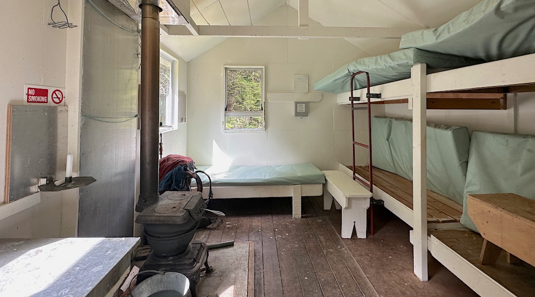 5 bunks and an old Oregon woodburner. | Mid Silverstream Hut, Leatham Conservation Area