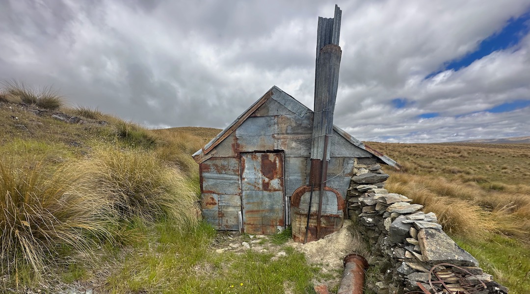 The old chimney lies on the ground. | Garden Gully Hut, Oteake Conservation Park