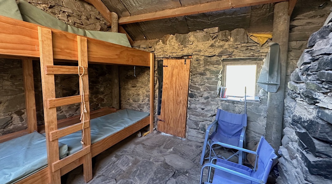 Bunks and flagstones. | Hut Stream Hut, Oteake Conservation Park