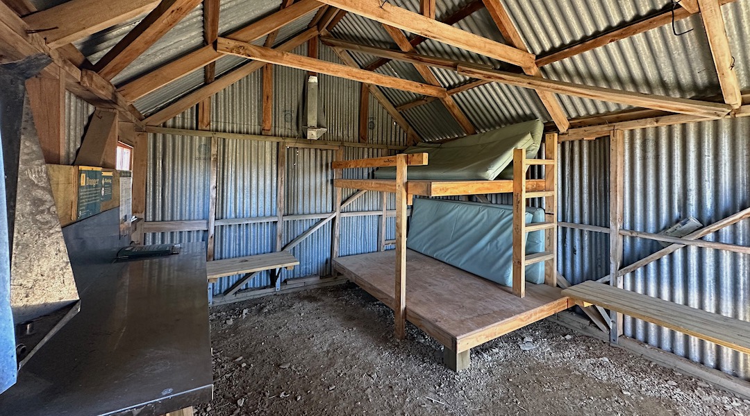 Renovated bunks and gravel floor. | Wire Yards Hut, Oteake Conservation Park