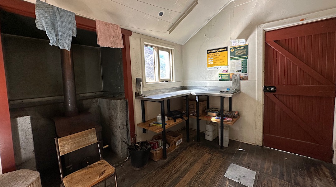 Kitchen bench & woodburner. | Ahuriri Base Hut, Ahuriri Conservation Park