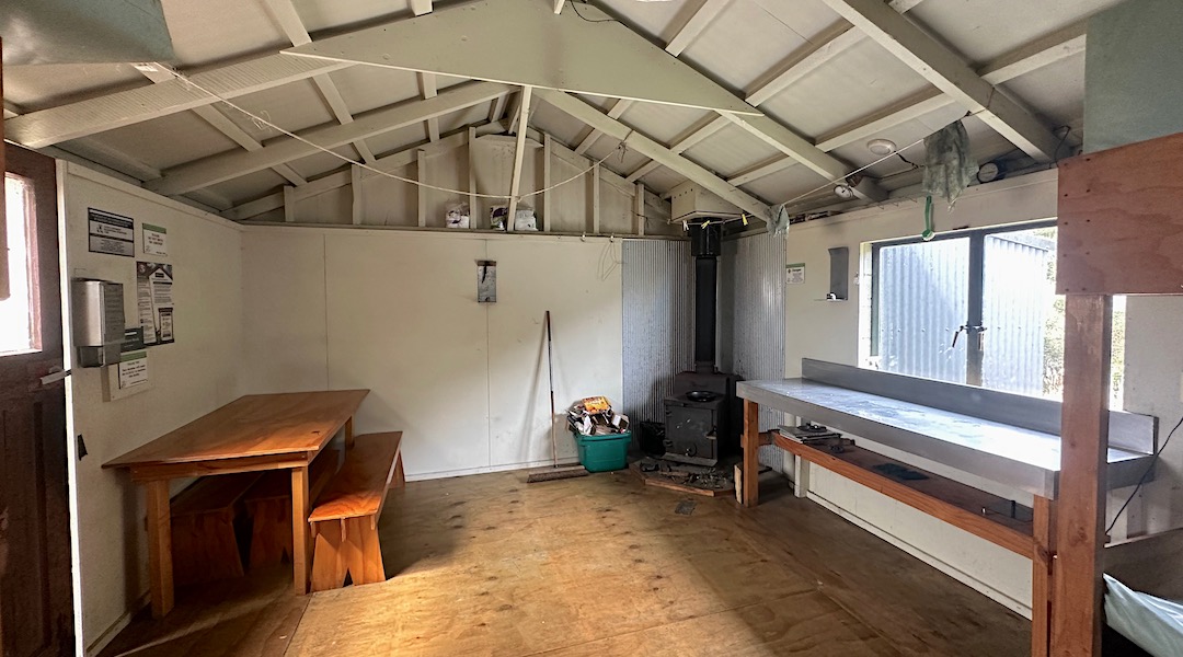 Kitchen bench and woodburner.  | Growler Hut, Te Kahui Kaupeka Conservation Park