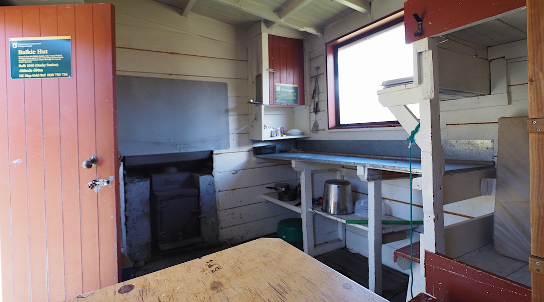 Kitchen and woodburner. | Baikies Hut, Ruataniwha Conservation Park
