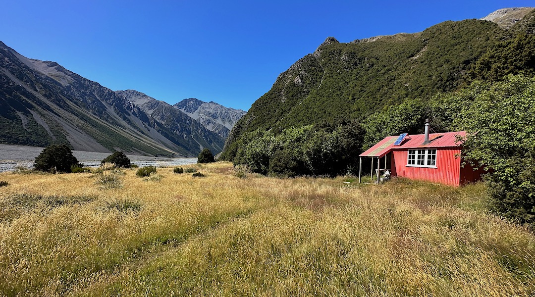 The hut is on a river terrace above the Havelock River. | St Winifreds Hut, Te Kahui Kaupeka Conservation Park