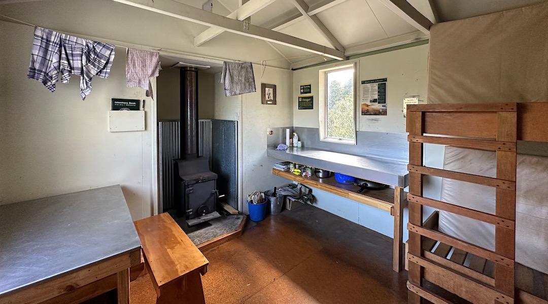 Stainless steel kitchen benchtop. | Curtis Memorial Hut, Havelock River 