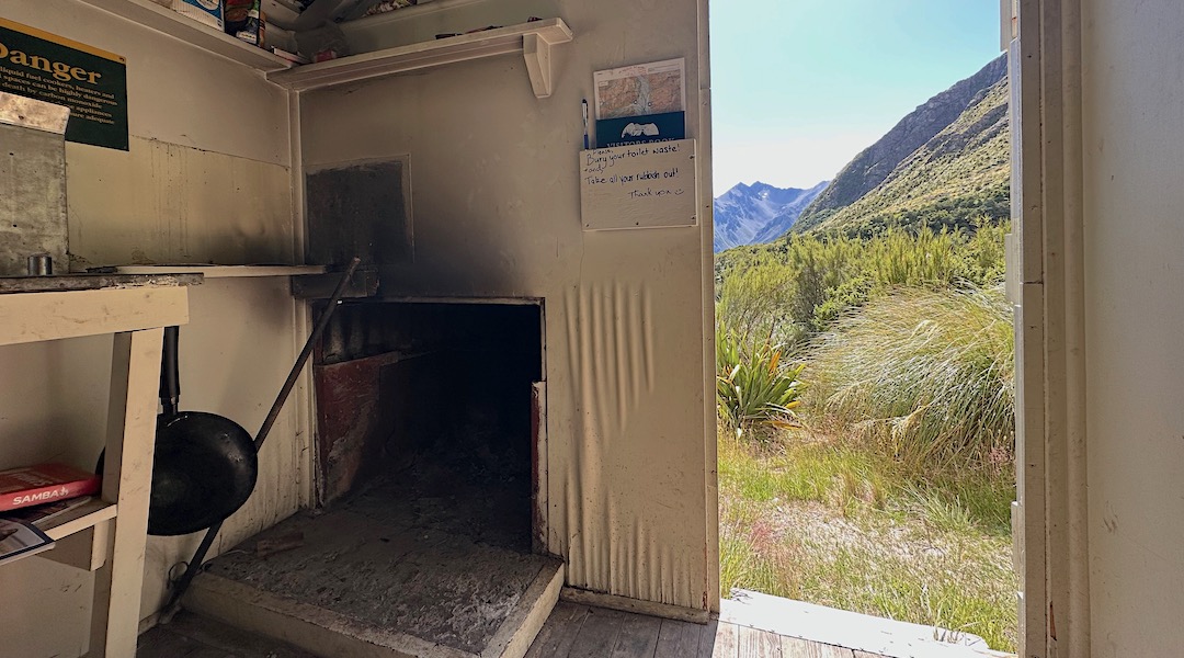 The chimney has been renovated, but the area lacks fuel. | Murphys Bivvy, Te Kahui Kaupeka Conservation Park