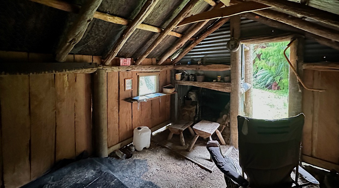 Note the treated timber poles together with more traditional materials. | Adams Flat Hut, Kahurangi National Park