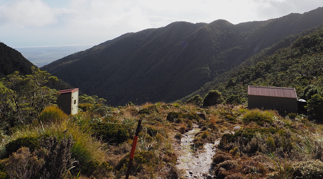Fine view of Westport, the Buller River, and the Tasman Sea.  | Buckland Peaks Hut, Stewardship Land