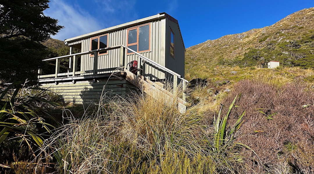 You need to drop vertical 80 m down that hill.  | Buckland Peaks Hut, Stewardship Land