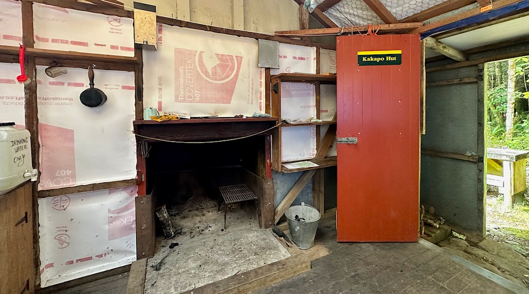 The open fireplace allows for plenty of ventilation. | Kakapo Hut, Kahurangi National Park