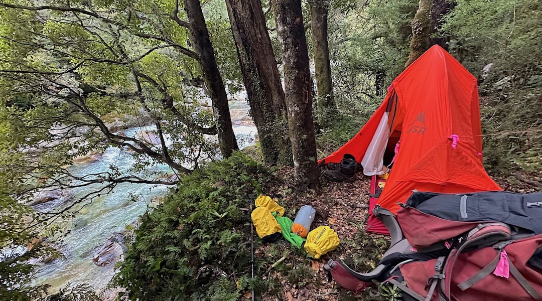 Camping on a small site right above the Kakapo River.  | West Coast blog, April 2023