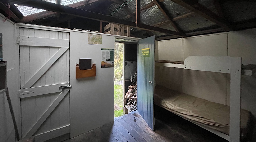 Four bunk hut, with a porch. | Moa Stream Hut, Craigieburn Forest Park