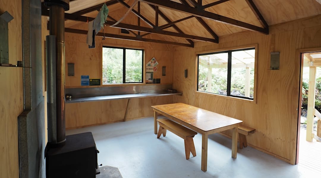 Kitchen bench and table. | Belltown Manunui Hut, Wangapeka Track, Westland