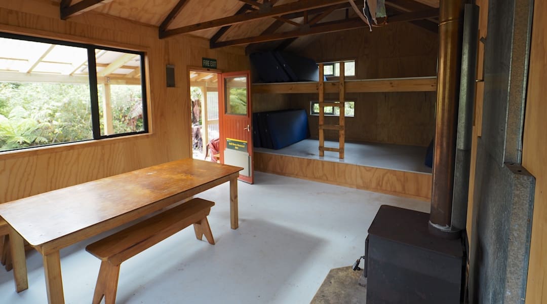Kitchen bench and table. | Belltown Manunui Hut, Wangapeka Track, Westland